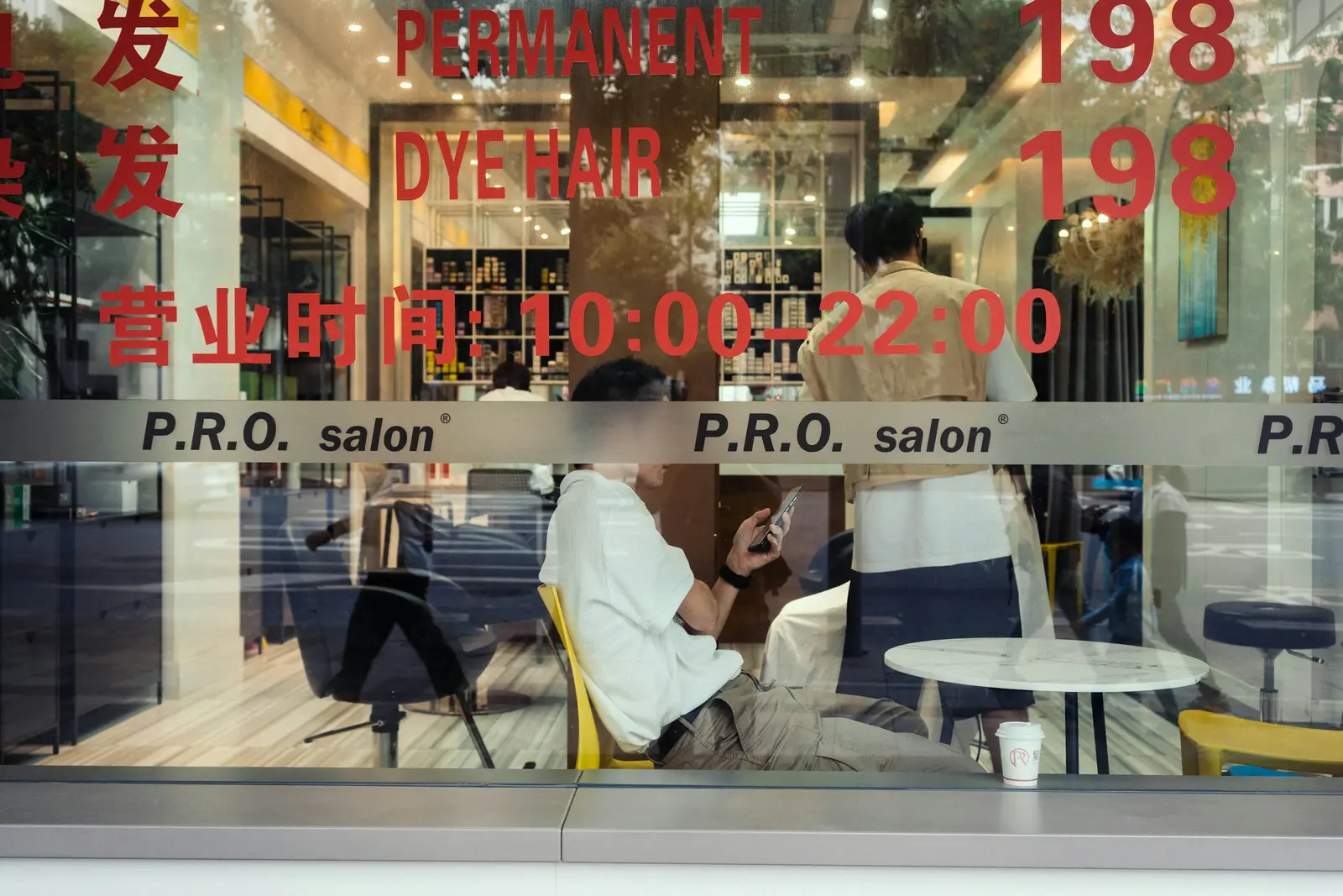 A hair salon seen through its front window